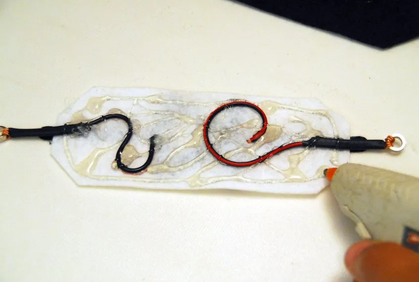 Final Assembly: Applying glue from gluegun to felt